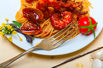 Image showing Italian seafood spaghetti pasta on red tomato sauce