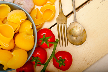 Image showing Italian snail lumaconi pasta with tomatoes