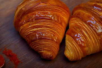 Image showing french traditiona croissant brioche butter bread  on wood