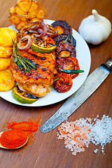 Image showing roasted grilled BBQ chicken breast with herbs and spices