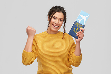 Image showing happy woman with air ticket and immunity passport