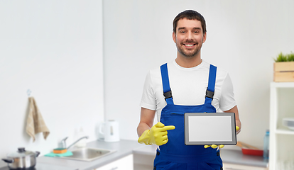 Image showing male cleaner showing tablet pc at at kitchen