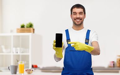 Image showing male worker or cleaner with smartphone at kitchen