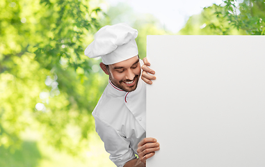 Image showing happy smiling male chef with big white board