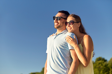 Image showing happy couple hugging outdoors in summer