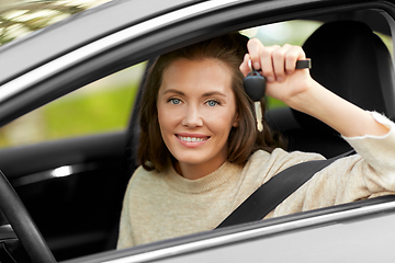 Image showing woman or female driver with car key in city