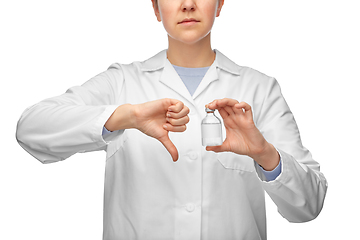 Image showing female doctor with medicine showing thumbs down