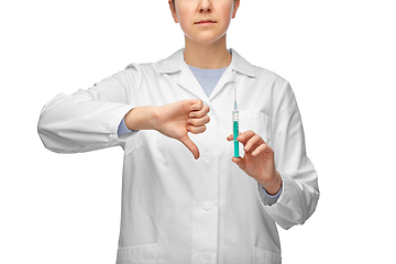 Image showing female doctor with syringe showing thumbs down