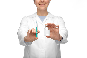 Image showing close up of doctor with medicine and syringe