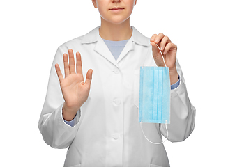 Image showing female doctor with mask showing stop gesture