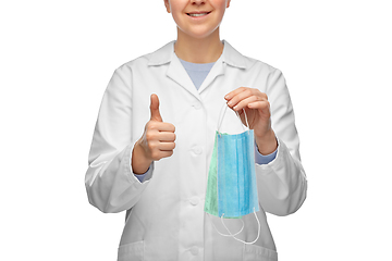 Image showing smiling doctor with two masks showing thumbs up