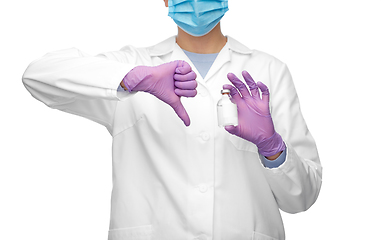 Image showing close up of doctor with medicine shows thumbs down