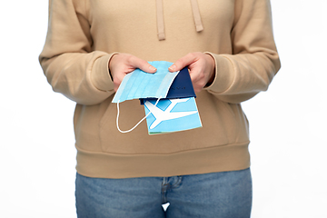 Image showing woman with mask, passport and air ticket