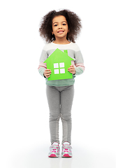 Image showing smiling african girl holding green house icon