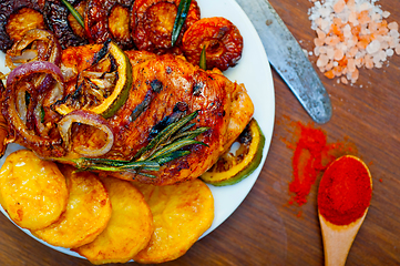 Image showing roasted grilled BBQ chicken breast with herbs and spices