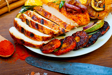 Image showing roasted grilled BBQ chicken breast with herbs and spices