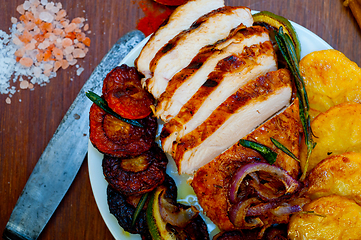 Image showing roasted grilled BBQ chicken breast with herbs and spices