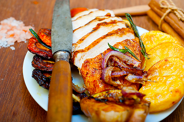 Image showing roasted grilled BBQ chicken breast with herbs and spices