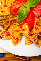 Image showing Italian pasta farfalle butterfly bow-tie and tomato sauce