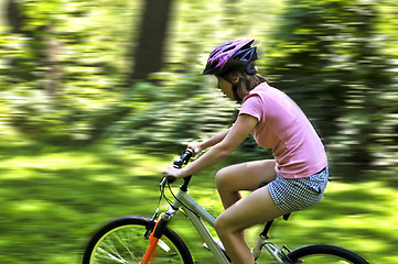 Image showing Teenage girl on a bicycle