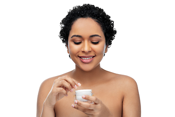 Image showing young african american woman with moisturizer