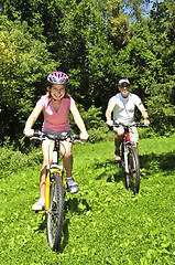 Image showing Family riding bicycles