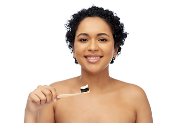 Image showing smiling woman with toothbrush cleaning teeth