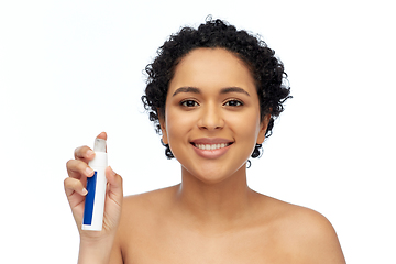 Image showing happy african woman with spray bottle