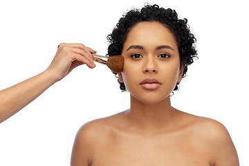 Image showing woman and hand of make up artist with brush