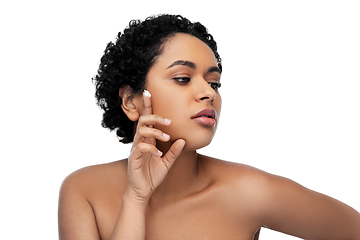 Image showing young african american woman with moisturizer