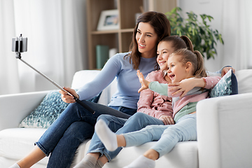 Image showing happy family taking selfie by smartphone at home