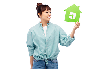 Image showing smiling asian woman holding green house