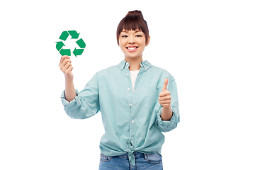 Image showing smiling asian woman holding green recycling sign