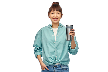 Image showing woman with thermo cup or tumbler for hot drinks