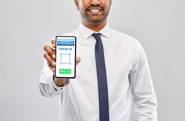 Image showing man with virtual immunity passport on smartphone