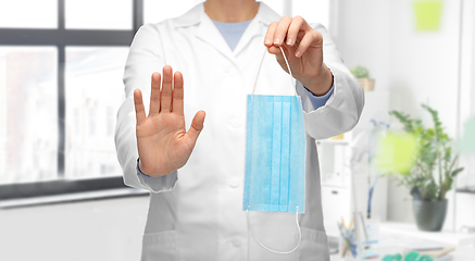 Image showing female doctor with medical mask showing stop