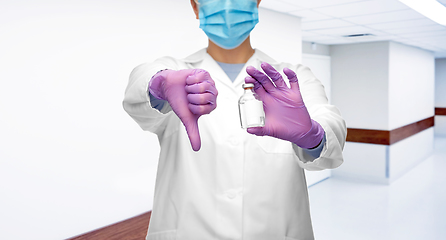 Image showing close up of doctor with medicine shows thumbs down