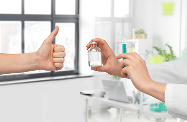 Image showing hand with medicine and showing thumbs up