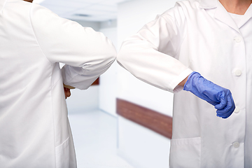 Image showing close up of doctors make elbow bump gesture