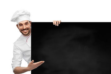 Image showing happy smiling male chef with big black chalkboard
