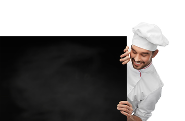 Image showing happy smiling male chef with big black chalkboard