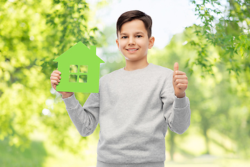 Image showing smiling boy with green house and showing thumbs up