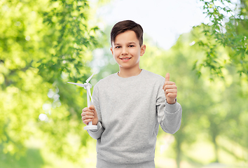 Image showing smiling boy with toy wind turbine