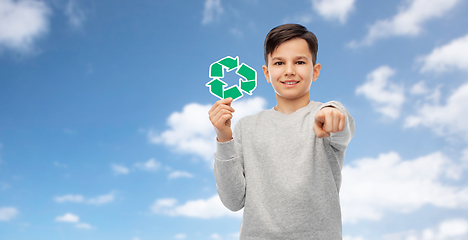 Image showing happy boy with recycling sign pointing to you