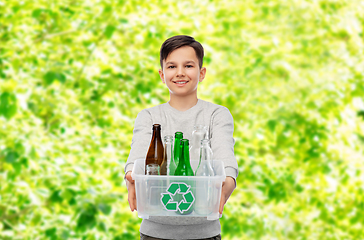 Image showing smiling boy sorting glass waste