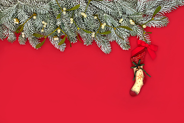 Image showing Christmas Eve Red Background with Retro Stocking Tree Decoration
