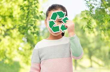 Image showing smiling girl holding green recycling sign