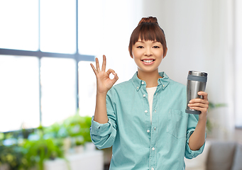 Image showing woman with thermo cup or tumbler showing ok sign