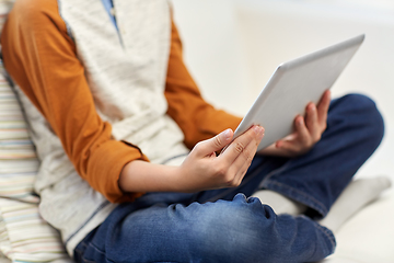 Image showing close up of boy with tablet pc computer at home