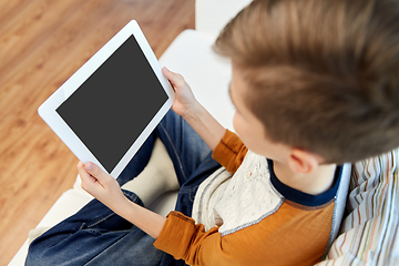 Image showing close up of boy with tablet pc computer at home